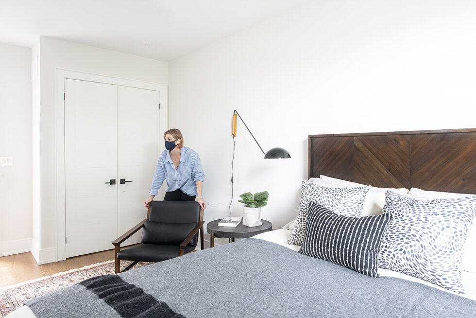 Melissa adjusting furntiure main bedroom Durant project